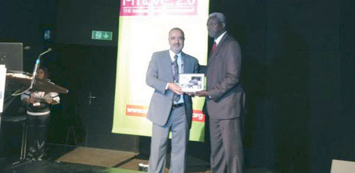 Dr Abu-Dayya receiving the award in Geneva.