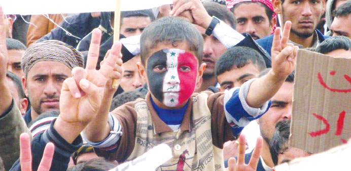 Iraqi protesters participate in a rally yesterday to call for the governmentu2019s fall in Hawijah, near the ethnically mixed city of Kirkuk.