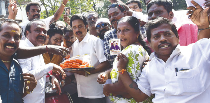 AIADMK supporters celebrate party candidate S Valarmathiu2019s victory in Srirangam, in Chennai yesterday.