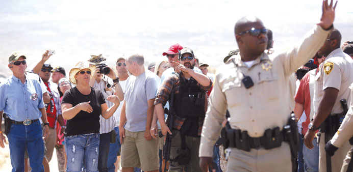 Protesters yell at police near the Bureau of Land Managementu2019s base camp.