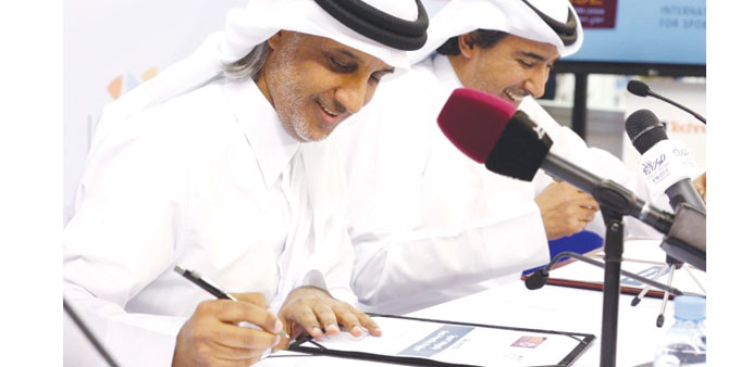 QFA  President Sheikh Hamad bin Khalifa bin Ahmad al-Thani (L) and ICSS President Mohamed Hanzab signing a sport integrity partnership agreement yeste