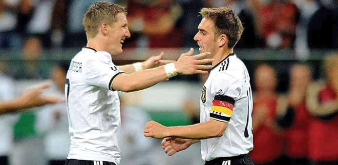 German midfield general Bastian Schweinsteiger (left) is the front-runner to become the World Cup winnersu2019 captain after the surprise international re