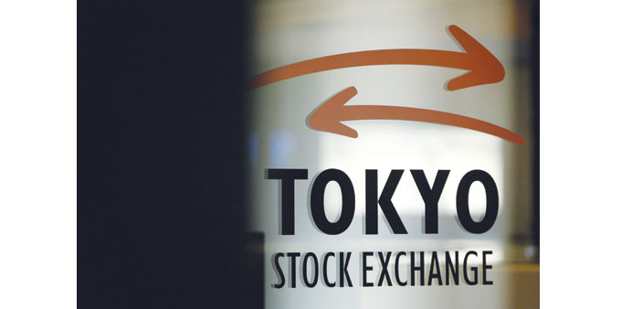 The Tokyo Stock Exchange logo is displayed on a glass door at the bourse in Tokyo. Japanese stocks closed up 0.29% yesterday.