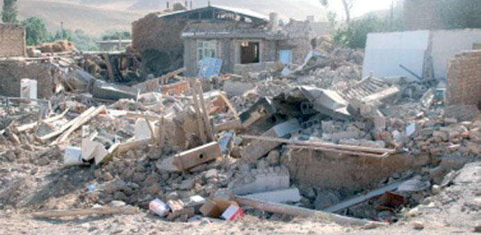 Damaged houses are seen after the earthquake struck near Bushehr yesterday. 