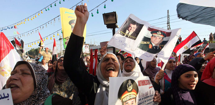 Opponents of Mursi demonstrate near the presidential palace in Cairo yesterday.