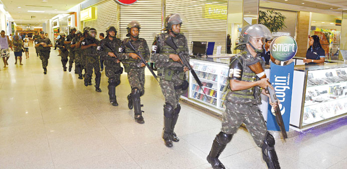Soldiers patrol a shopping centre during a strike in Salvador, Bahia state.