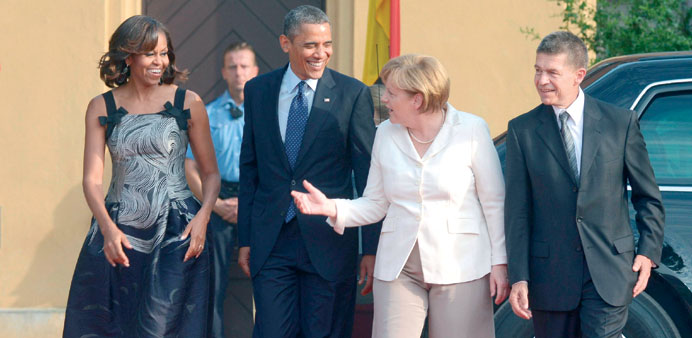 US President Barack Obama, his wife Michelle, German Chancellor Angela Merkel and her husband Joachim Sauer arrive for a dinner at the Charlottenburg 