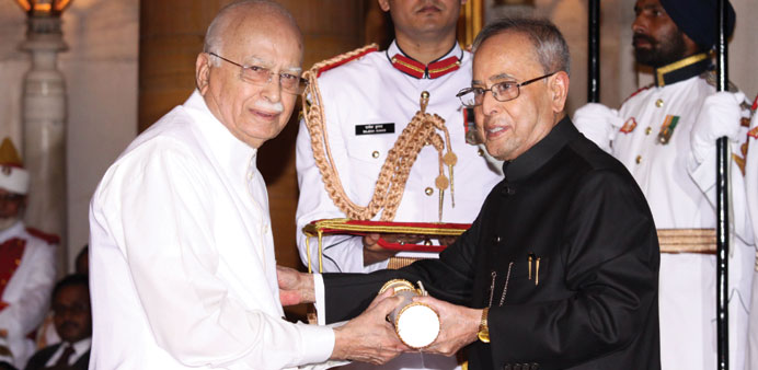 President Pranab Mukherjee presents the Padma Vibhushan Award to veteran politician and parliamentarian L K Advani yesterday.