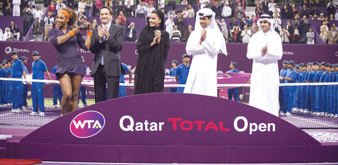    Her Highness Sheikha Moza bint Nasser presents the runner-up trophy to Serena Williams after the 2013 Qatar Total Open final in Doha on Sunday. PIC