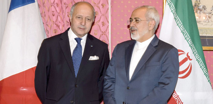 French Foreign Minister Laurent Fabius meets with Iranian counterpart Mohamed Javad Zarif in Lausanne yesterday.