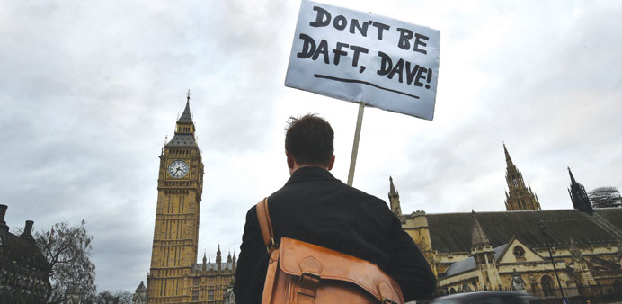 A lone protester outside the Houses of Parliament in London yesterday.