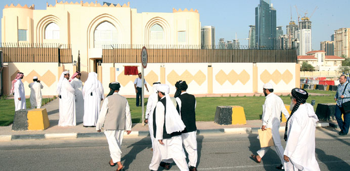 File photo of Taliban officials walking towards their office in Doha.