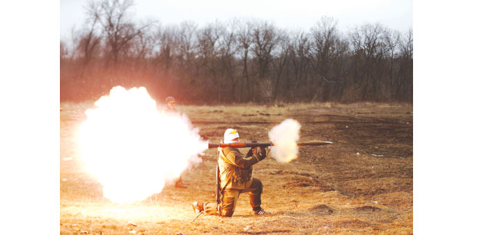 A volunteer of the separatist self-proclaimed u2018Donetsk Peopleu2019s Republicanu2019 guard fires a rocket-propelled grenade (RPG) during training in Donetsk.