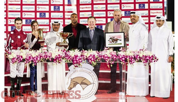 Colonel Jeffrey Merenkov (fourth from right), of the US Army, with the winners of Musheireb Cup at the Qatar Racing and Equestrian Club yesterday. PICTURES: Juhaim