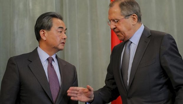 Russian Foreign Minister Sergei Lavrov and his Chinese counterpart Wang Yi attend a news conference following their meeting in Moscow on Friday.