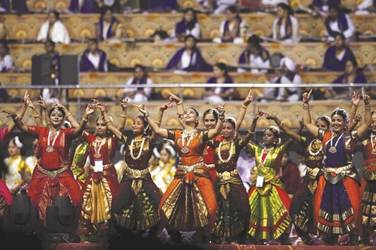 Participants perform at the venue of World Culture Festival on the banks of a river in New Delhi, India, yesterday. The three-day cultural festival, expected to attract 3.5mn visitors to the capital, began yesterday despite running into trouble over safety and environmental concerns. It is being organised by spiritual guru Sri Sri Ravi Shankar to celebrate the 35th anniversary of his Art of Living Foundation.