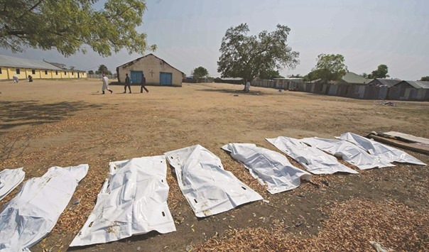 This file photo taken on January 27, 2014 shows sheets covering the bodies of 16 people,  allegedly civilians killed when they took cover near Leudit church in Bor town, according to the South Sudanese military. The number of deaths in South Sudanu2019s two-year civil has gone largely unrecorded. Estimates vary, with the UN sticking a guesstimate of 10,000 dead since the early months of the war, while the International Crisis Group (ICG), which has closely tracked the fighting, told AFP in November 2014 that at least 50,000 had died a year into the war. Aid workers and officials who did not want to speak on the record said the true figure might be as high as 300,000 u2013 a figure comparable to the number killed in Syria during five years of fighting.