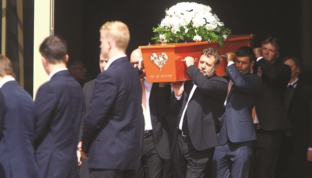 Pallbearers, including Hollywood actor Russell Crowe, carry the casket of former New Zealand Cricketer Martin Crowe during his funeral at the Holy Trinity Cathedral in Auckland yesterday. Cricketing greats honoured Martin Crowe at an emotional funeral for New Zealand's greatest batsman, who passed away on March 4 aged 53 after a long battle with cancer. (AFP)