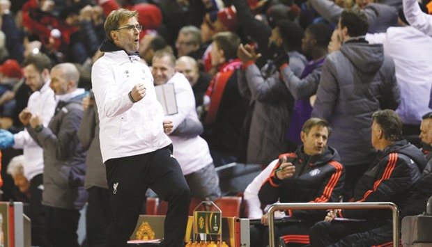 Liverpool manager Juergen Klopp celebrates after Roberto Firmino scored their second goal against Manchester United.