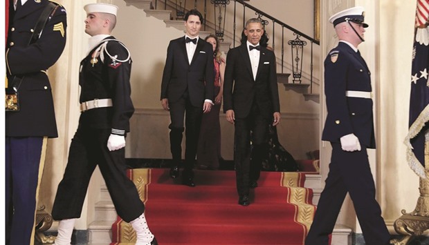 President Barack Obama walking with Prime Minister Justin Trudeau before a state dinner at the White House in Washington on Thursday.