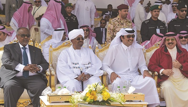 HH the Emir Sheikh Tamim bin Hamad al-Thani watching  a military parade, held at the King Khalid Military City in the Hafr Al-Batin region, northern Saudi Arabia, yesterday afternoon, along with leaders and heads of delegations of the countries participating in Raad Al-Shamal (Northern Thunder) drills.