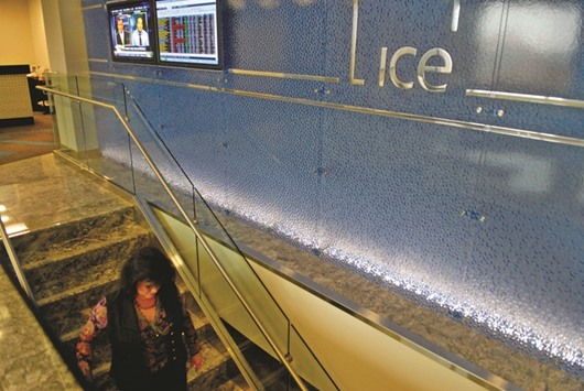An employee walks down the stairs in the main offices of the Intercontinental Exchange in Atlanta, Georgia. The ICE said itu2019s exploring an offer for the London Stock Exchange Group, attempting to scuttle the UK companyu2019s merger talks with Deutsche Boerse, which would create a dominant European stock exchange operator.