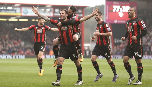Steve Cook celebrates scoring the third goal for Bournemouth against Swansea City during their EPL clash.