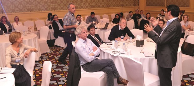 A biomedical researcher speaking at a session.