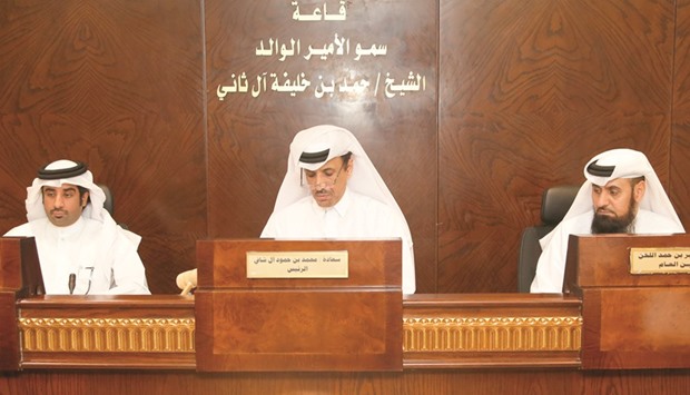 CMC chairman Mohamed Hamoud al-Shafi (centre) and vice-chairman Hamad Lahdan al-Mohannadi (left) at the session.