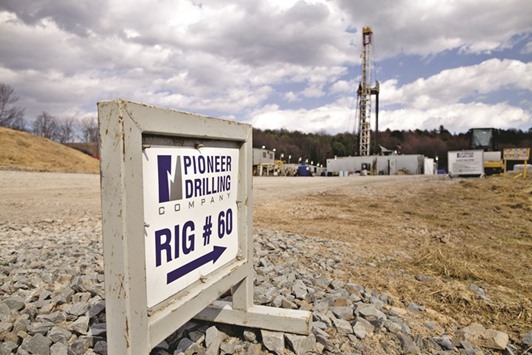 A Pioneer Drilling Co sign is seen at the entrance to an Alta Resources natural gas well site near Montrose, Pennsylvania. Top US shale producers are pushing fracking technology to new extremes to get more oil out of their wells, as they weather low oil prices.