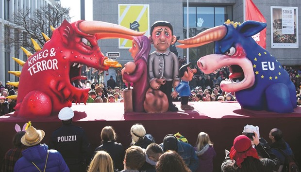 A carnival float on European refugee politics is displayed during the street parade in Duesseldorf, western Germany.