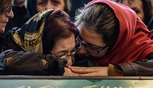 Women mourn near a coffin during a funeral ceremony in a mosque in Ankara on Monday for the victims of a suicide car bomb.