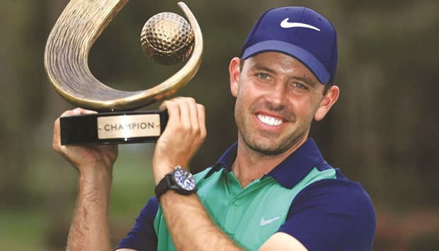 Charl Schwartzel of South Africa poses with the trophy after winning the Valspar Championship at Innisbrook Resort Copperhead Course in Palm Harbor, Florida on Sunday. (AFP)