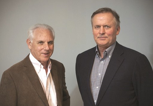 Author John Grisham, right,  and Neal Kassell, neurosurgeon and founder of the Focused Ultrasound. A new book by bestselling author Grisham is sparking interest from scientists, patients and investors in a handful of companies developing what they say could be a trailblazing treatment for cancer and Alzheimeru2019s disease.