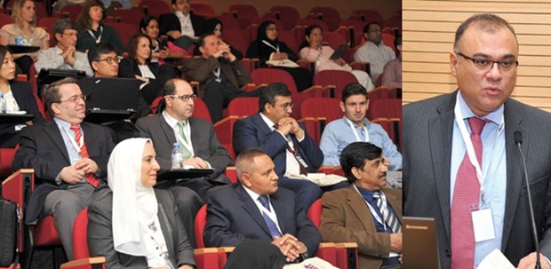 Participants of the symposium. Right: Dr Eyad Masad