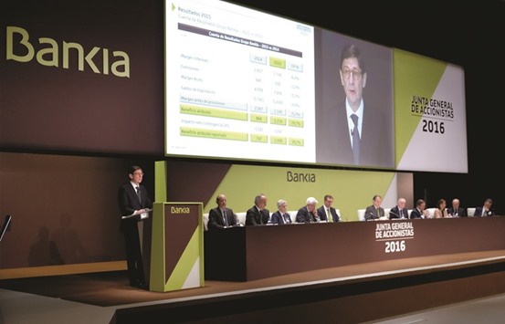 Bankiau2019s executive chairman Jose Ignacio Goirigolzarri (left) delivers a speech during the annual shareholder meeting of Spainu2019s largest nationalised bank in Valencia. After losing two appeals, Bankia and its parent holding BFA set aside u20ac1.84bn to cover claims by small investors who held 60% of the banku2019s shares and saw their investments almost wiped out after the flotation.