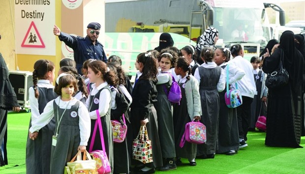 Schoolchildren visiting GCC Traffic Week events at Darb Al Saie.