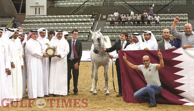 Sheikh Nawaf bin Nasser al-Thani presents the winneru2019s trophy after Farhoud Al Shaqab amassed 21 points to win the championship gold among the Senior Stallions in the 6th Qatar International Arabian Peninsula Horse Show at Al Shaqab Arena yesterday. PICTURES: Juhaim