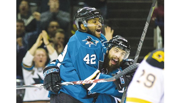 San Jose Sharks right wing Joel Ward (left) celebrates scoring against the Boston Bruins during their NHL game at SAP Center in San Jose, California, on Tuesday. (USA TODAY Sports)