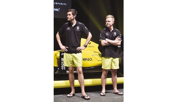 Renault F1 team drivers Kevin Magnussen of Denmark (right) and Jolyon Palmer of Britain pose in boardshorts at the teamu2019s livery launch at Docklands ahead of the Australian Formula One Grand Prix in Melbourne on Wednesday. (AFP)