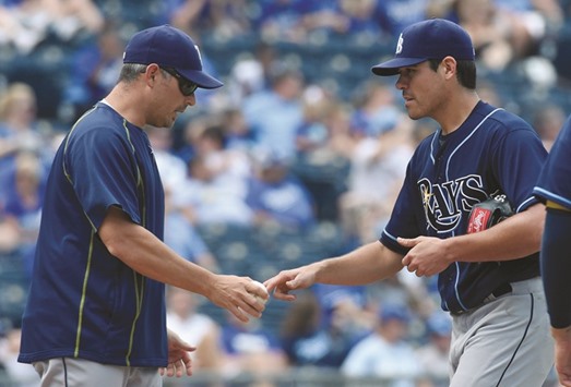 In this July 17, 2015, picture, Tampa Bay Rays manager Kevin Cash (left) relieves starting pitcher Matt Moore during their MLB game against the Kansas City Royals in Kansas City, Missouri. Moore will be the starting pitcher for the exhibition game against Cuba on March 22, while Dayron Varona  has also been added to the list. (Kansas City Star/TNS)