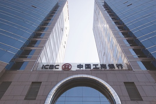 Industrial & Commercial Bank of Chinau2019s logo is seen outside its branch in Beijing. The cost of protecting debt in ICBC from default reached a record 199.5 basis points in January.