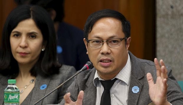 Romualdo Aggarado (right) of the Rizal Commercial Banking Corp (RCBC) testifies during a Senate hearing of money laundering involving the theft of $81mn from the US account of the Bangladesh Bank, at the Philippine Senate in Manila on Thursday.