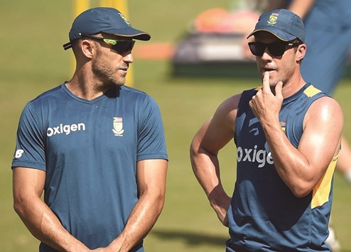 South Africau2019s skipper Faf du Plessis (left) and star batsman AB de Villiers talk to each other during a practice session at the Wankhede Stadium in Mumbai yesterday. (AFP)