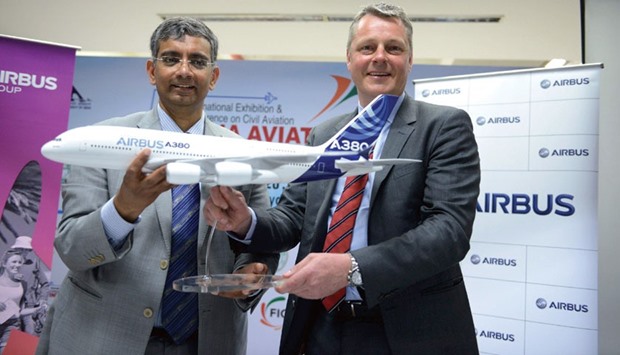 Airbus Division India president Srinivasan Dwarkanath (left) and vice president for marketing Asia/Customer Affairs Joost Van der Heijden hold a replica model of the Airbus-A380 aircraft during a press conference at the India Aviation 2016 airshow at Begumpet airport in Hyderabad yesterday.