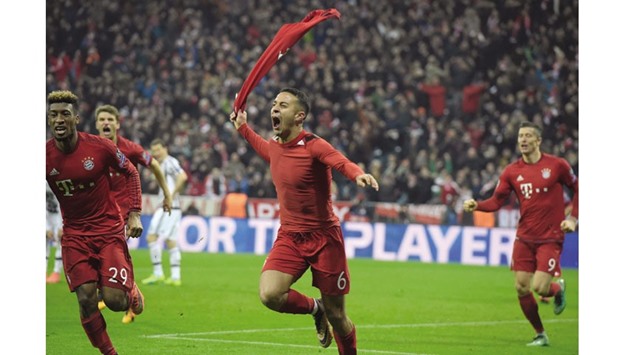 Bayern Munichu2019s Thiago Alcantara (C) celebrates after scoring during extra-time of the UEFA Champions League, Round of 16, second leg match against Juventus in Munich.