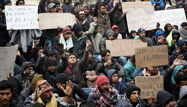 Pakistani migrants protest outside the Moria hot spot at the Greek island of Lesbos against the expulsion of 50 Pakistanis back to Turkey.