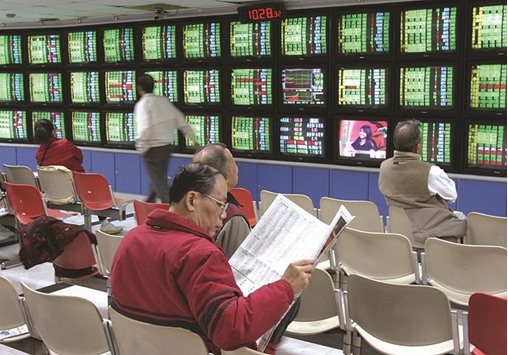 Traders keep an eye on the stock prices  at a securities trading company in Taipei. The Taiexu2019s 4.8% gain in 2016 compares with a 2.9% decline by the MSCI Asia Pacific Index, and the Taiwanese gauge is trading near the highest level relative to the broader measure in about a decade, according to data compiled by Bloomberg.