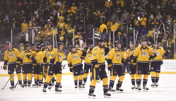 Nashville Predators players celebrate after a win against the New York Islanders on Thursday. Picture: Christopher Hanewinckel-USA TODAY Sports