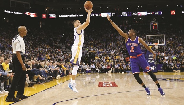 Stephen Curry of the Golden State Warriors shoots a three-pointer over Langston Galloway of the New York Knicks during their NBA game on Wednesday.
